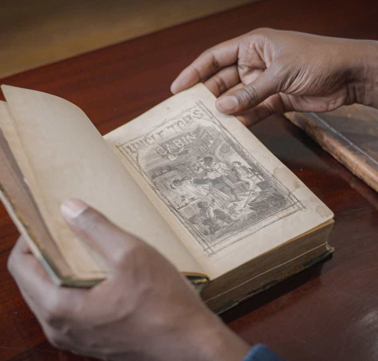 Jonathan Michael Square browses Uncle Tom's Cabin